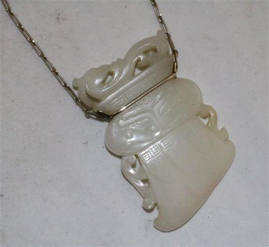 A Chinese archaistic white jade pendant, 19th / 20th century, (26cm drop), jade 6.7cm